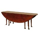 Good quality reproduction oval two flap dining table in the form of a George III wake table,