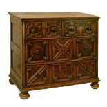 Antique Jacobean style oak chest, the two short and two long drawers with typical geometric
