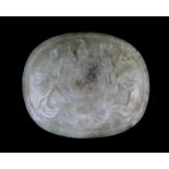 Chinese jade oval panel, pale green with brown markings, carved in relief with a central roundel