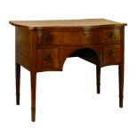 George III mahogany serpentine front kneehole dressing table fitted one long and two box drawers