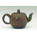 Yixing teapot of globular form, having a moulded bamboo handle and spout, calligraphic script to one