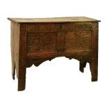 17th Century oak plank chest, the double panel front having carved oak leaf and acorn decoration and