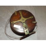 A VINTAGE MAHOGANY & BRASS FISHING REEL 4 " DIAMETER EST [£25- £50]