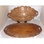 TWO CARVED FAR EASTERN TRAYS 24"X 15" AND ONE SMALLER PLACE SETTING 24"X 12" EST [£25- £50]