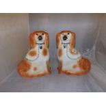 A PAIR OF STAFFORDSHIRE CHINA ORNAMENTAL DOGS EST [£20- £40]