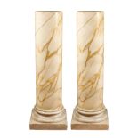 A pair of Calacatta gold marble columns 20th century h. 126 cm. standing on Carrara marble base,