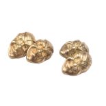 A pair of gold cuff-links  peso 7,5 gr. modelled like masks