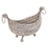 A silver basket Oriental manufacture, late 19th century peso 342 gr. ship-shaped decorated with