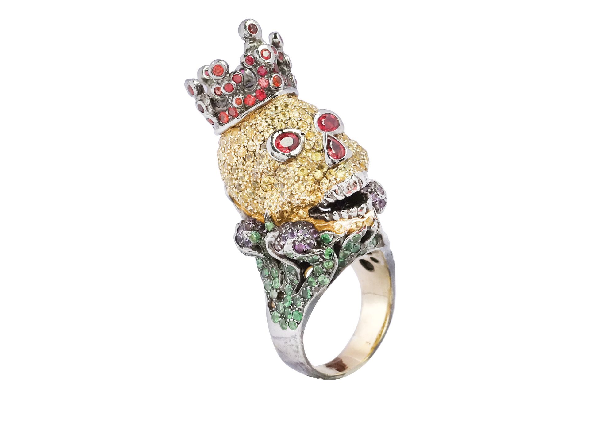 A silver and gemstone crowned skull ring