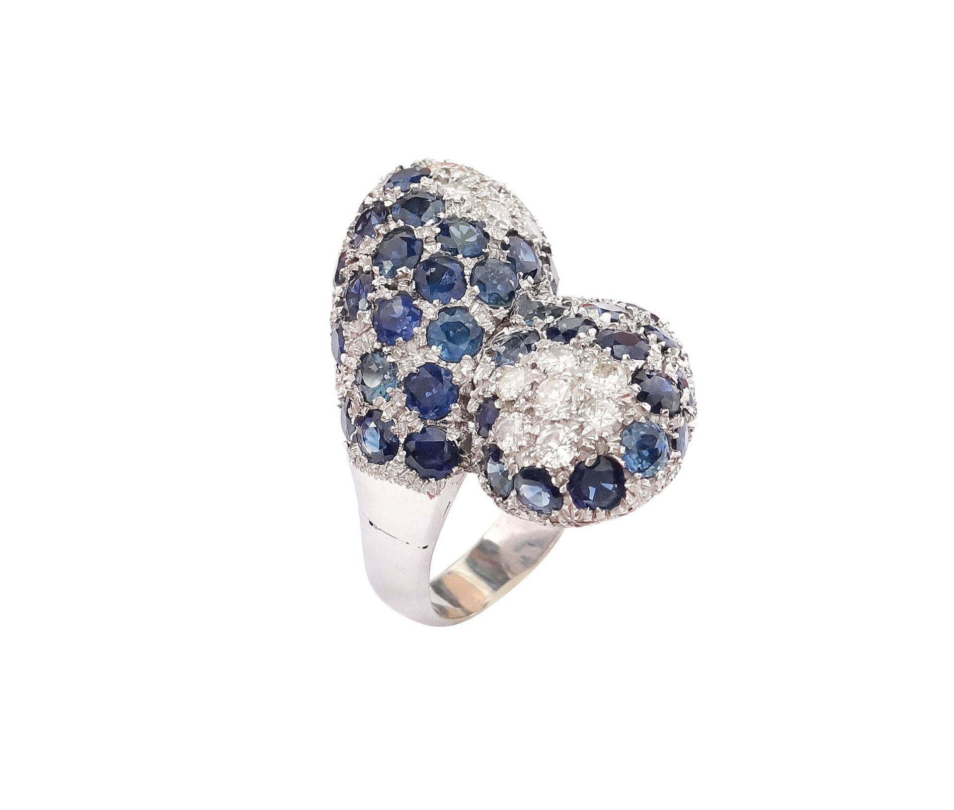 An 18k white gold, sapphire and diamond contrarie ring