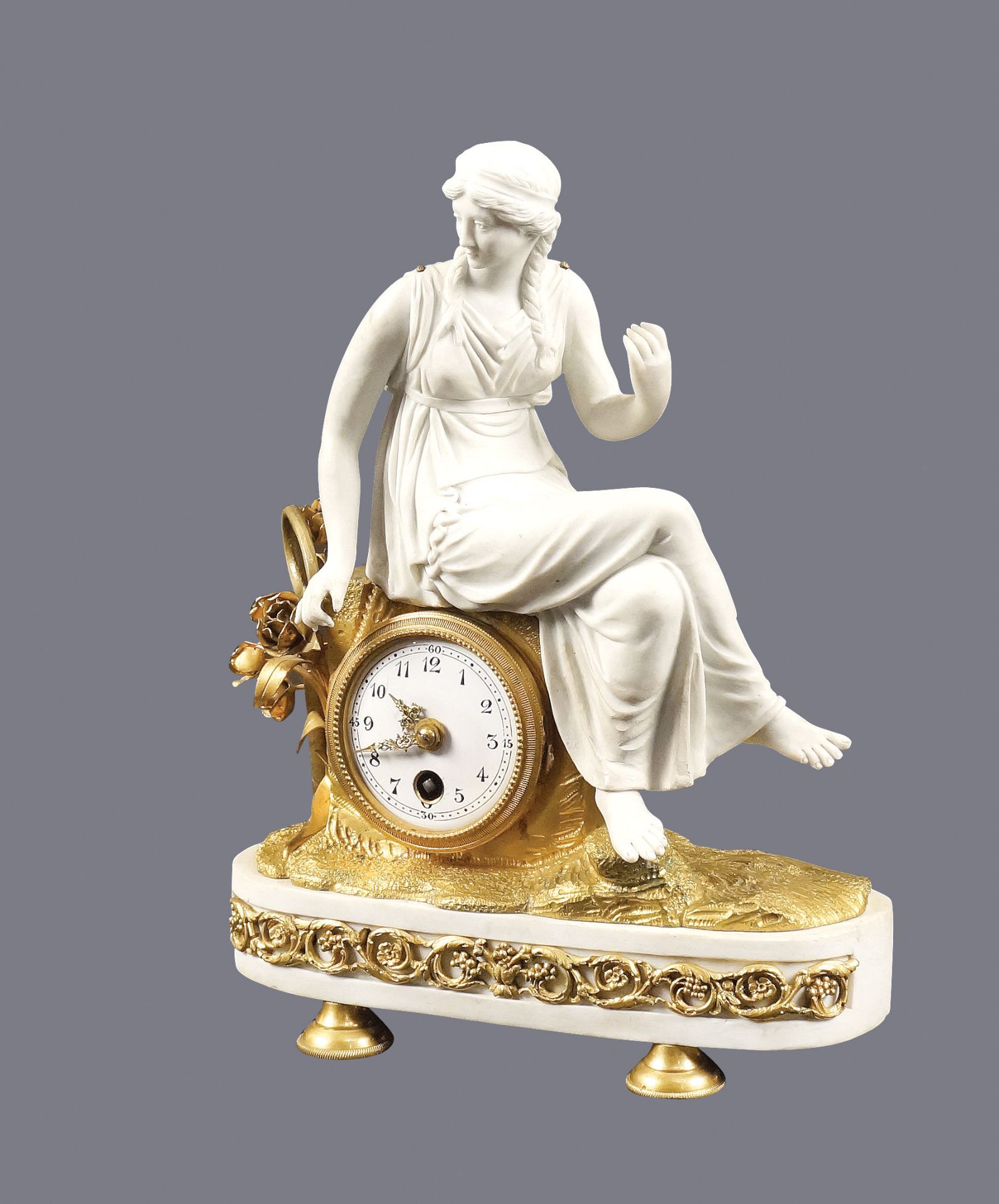 A French biscuit porcelain and gilt-bronze table clock