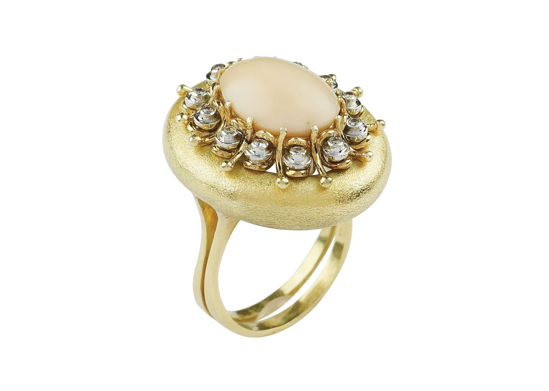An 18k gold, coral and diamond ring