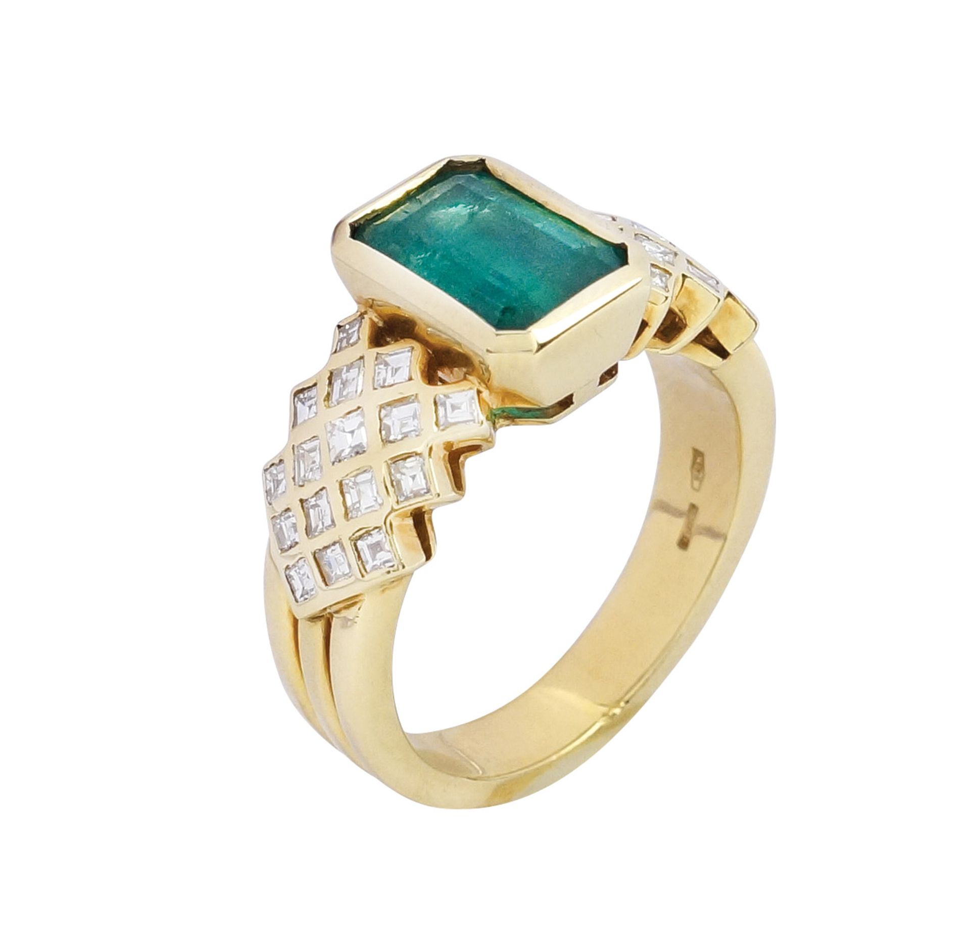 An 18k gold, emerald and diamond ring