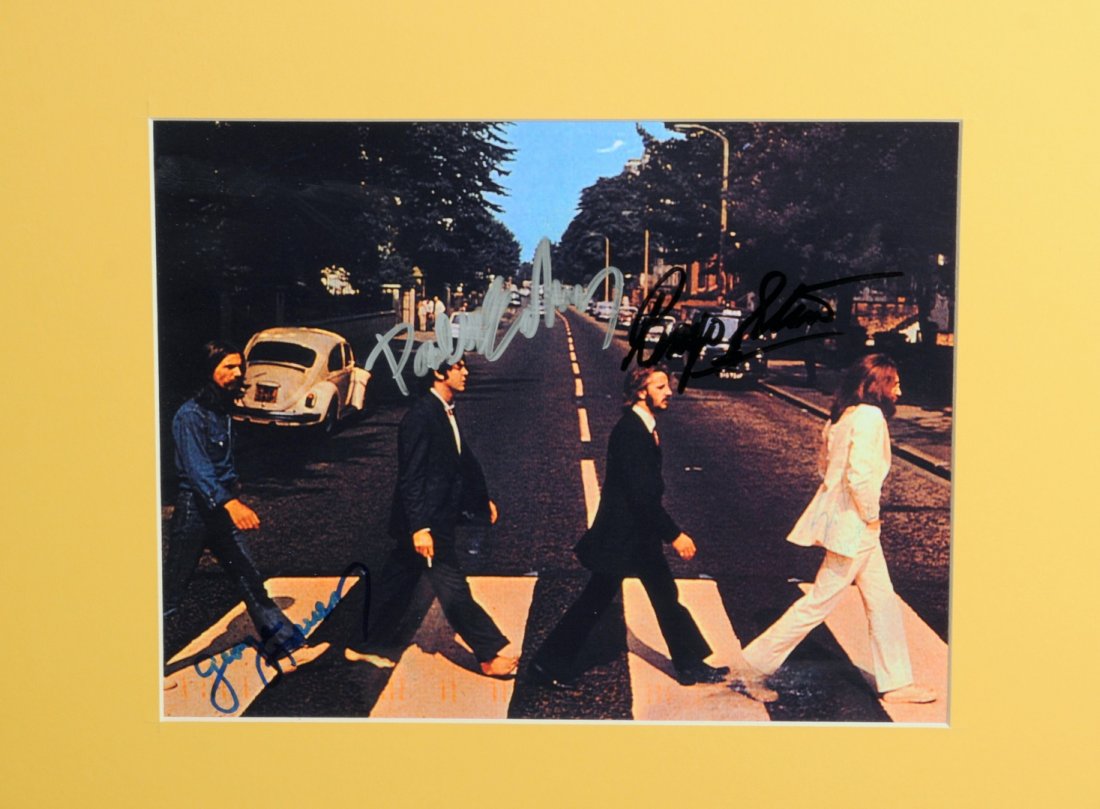 The Beatles: An autographed publicity photograph, the colour photograph taken in Abbey Road signed