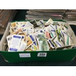 A box containing a large quantity of various tea cards.