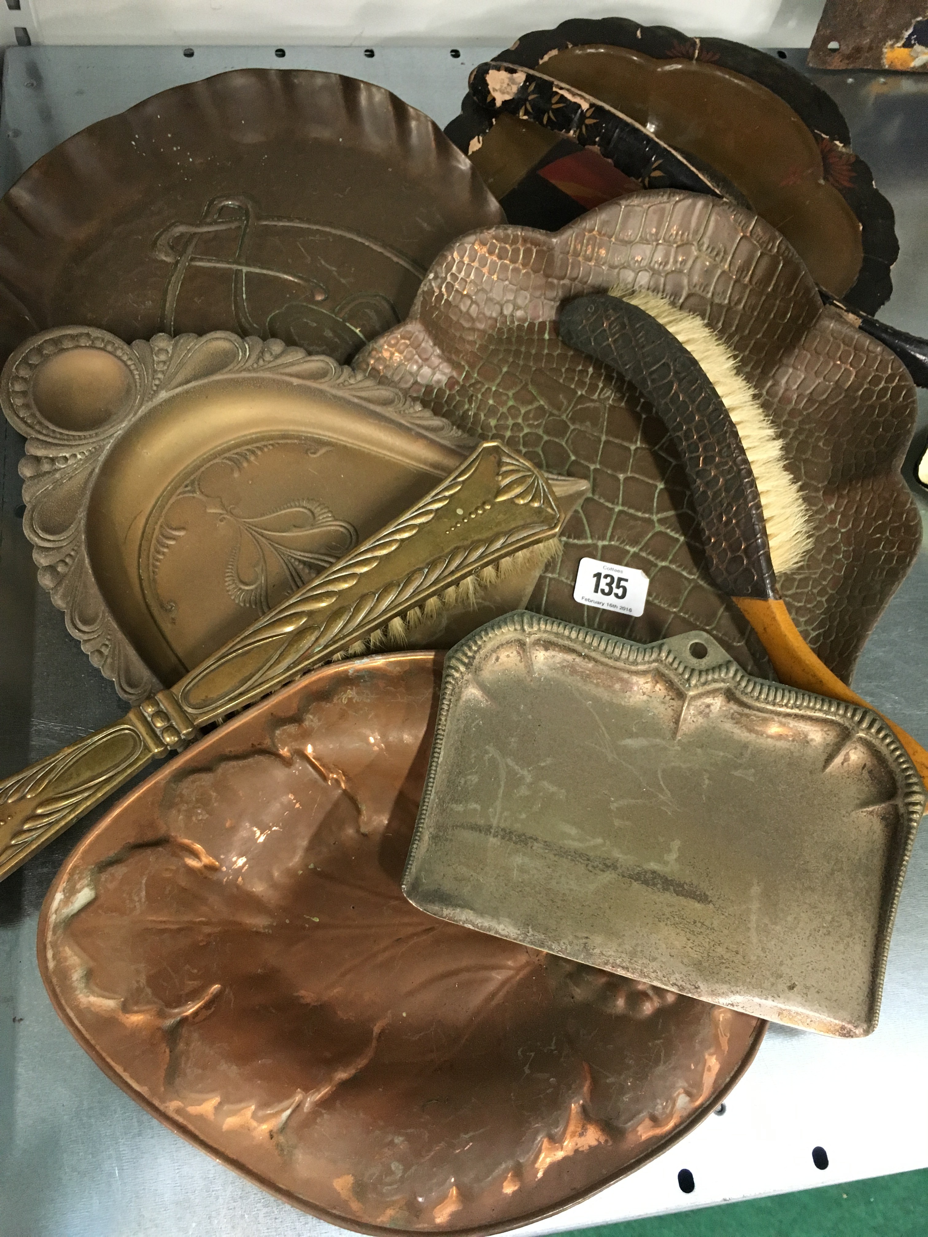 A collection of various Arts & Crafts and other brass and copper crumb trays and dishes.