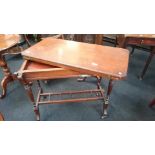 A mahogany twist top Edwardian games table resting on tapered column supports to castors and