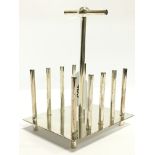 A Christopher Dresser style silver plated toast rack.