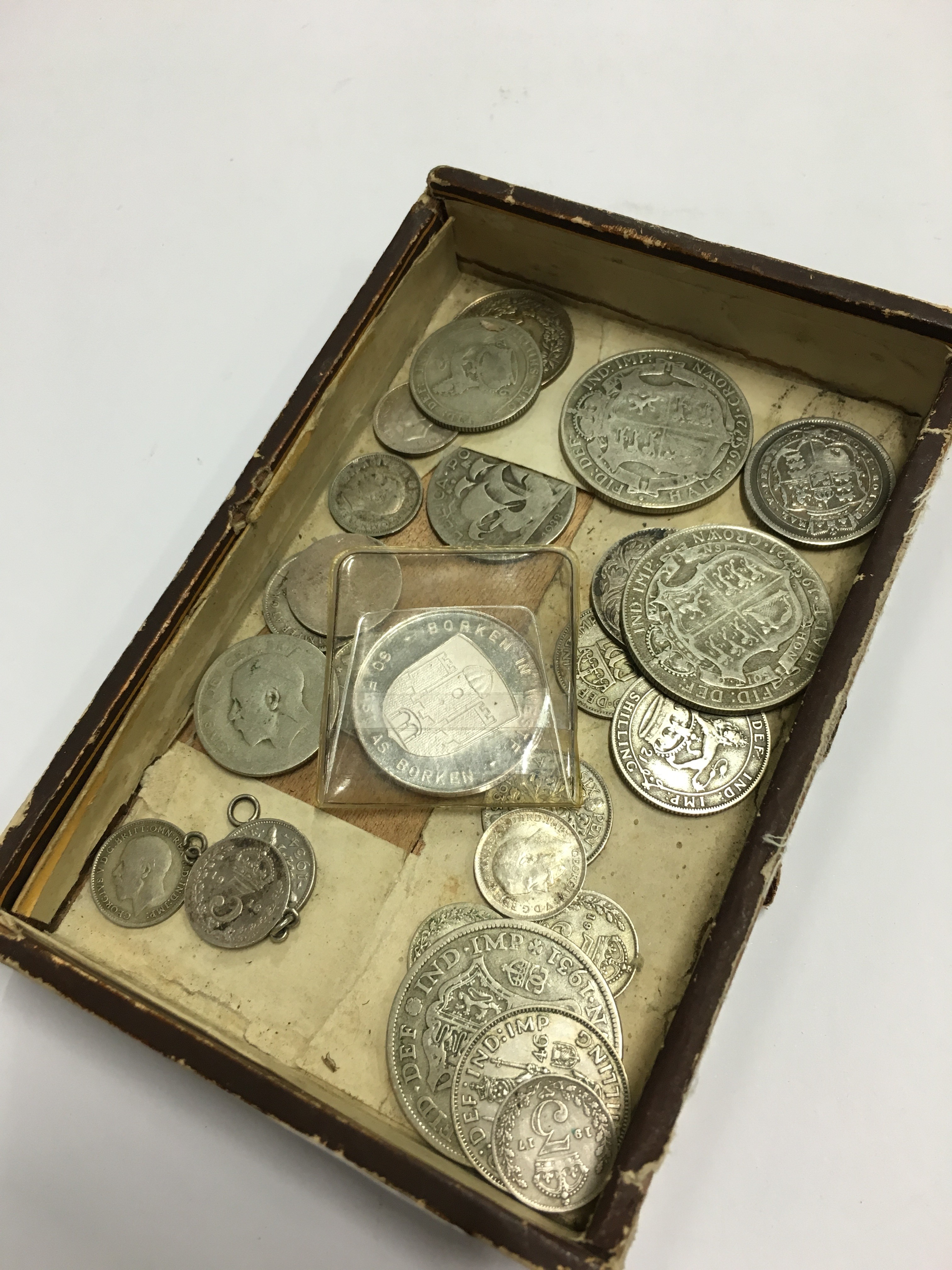 A small quantity of various silver coins.