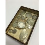 A small quantity of various silver coins.