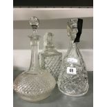 Three moulded glass decanters.