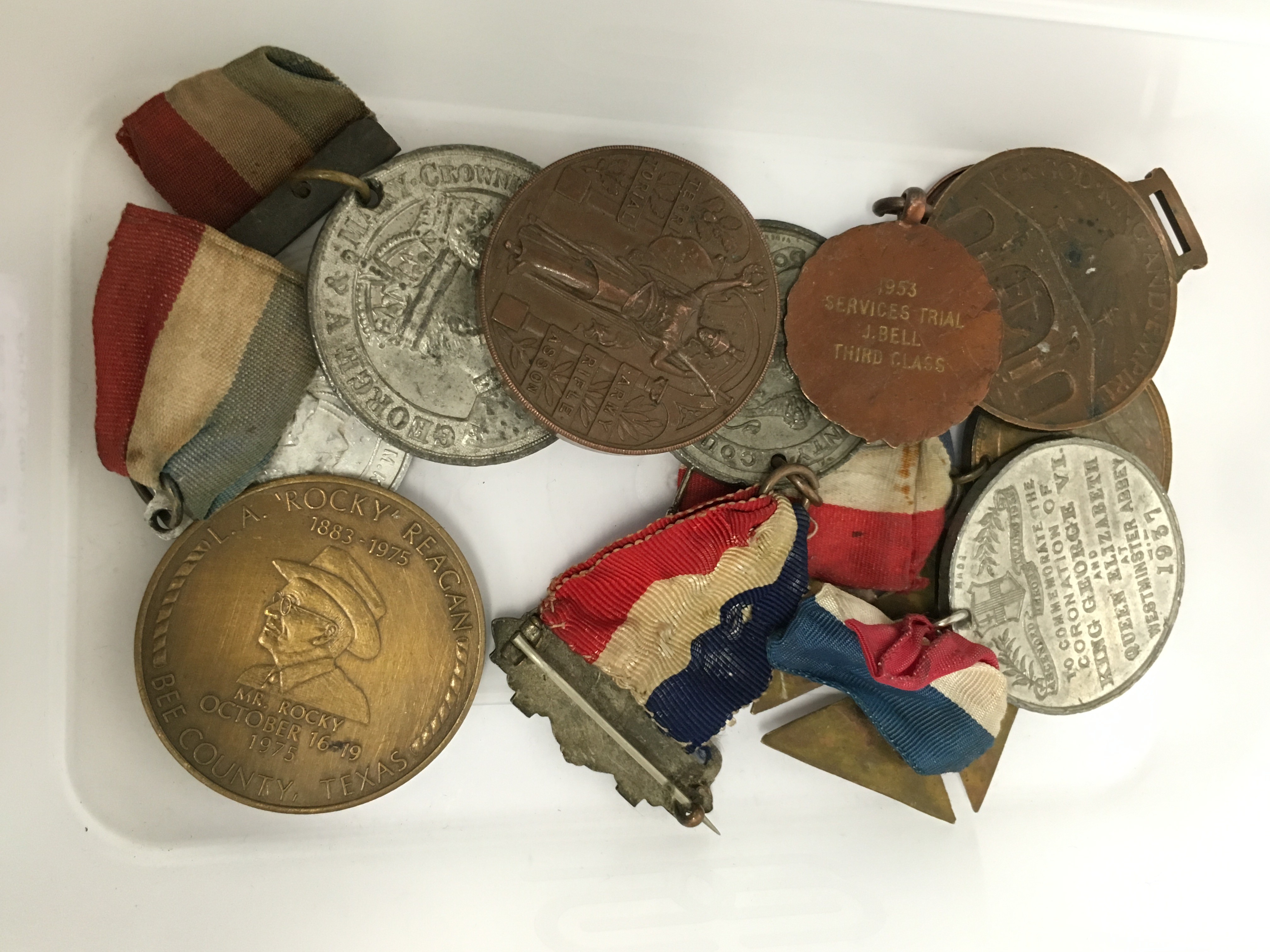 A carton containing various Attendance and other medals.