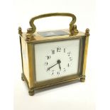 A small French brass and glass cased mantle clock (minor crack to dial).