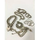 A collection of mixed silver jewellery items to include curb bracelets (150 grams overall).