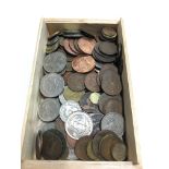 A box containing a small quantity of various coins.
