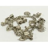 A large heavy silver charm bracelet.