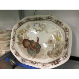 A large Johnson Bros. china meat plate decorated in the Barnyard King pattern.