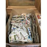 A box containing a mixed lot of various cigarette cards.