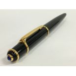 A Cartier Diabolo black cased ball point pen.