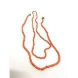 Two coral necklaces.