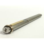 A Cartier silver and gilt metal cased Trilogy pen, serial No. 051090.