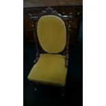 A walnut framed bedroom chair with gold fabric upholstered seat and back rest,