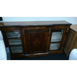 A large break front walnut Credenza with inlay and brass mounts to front,
