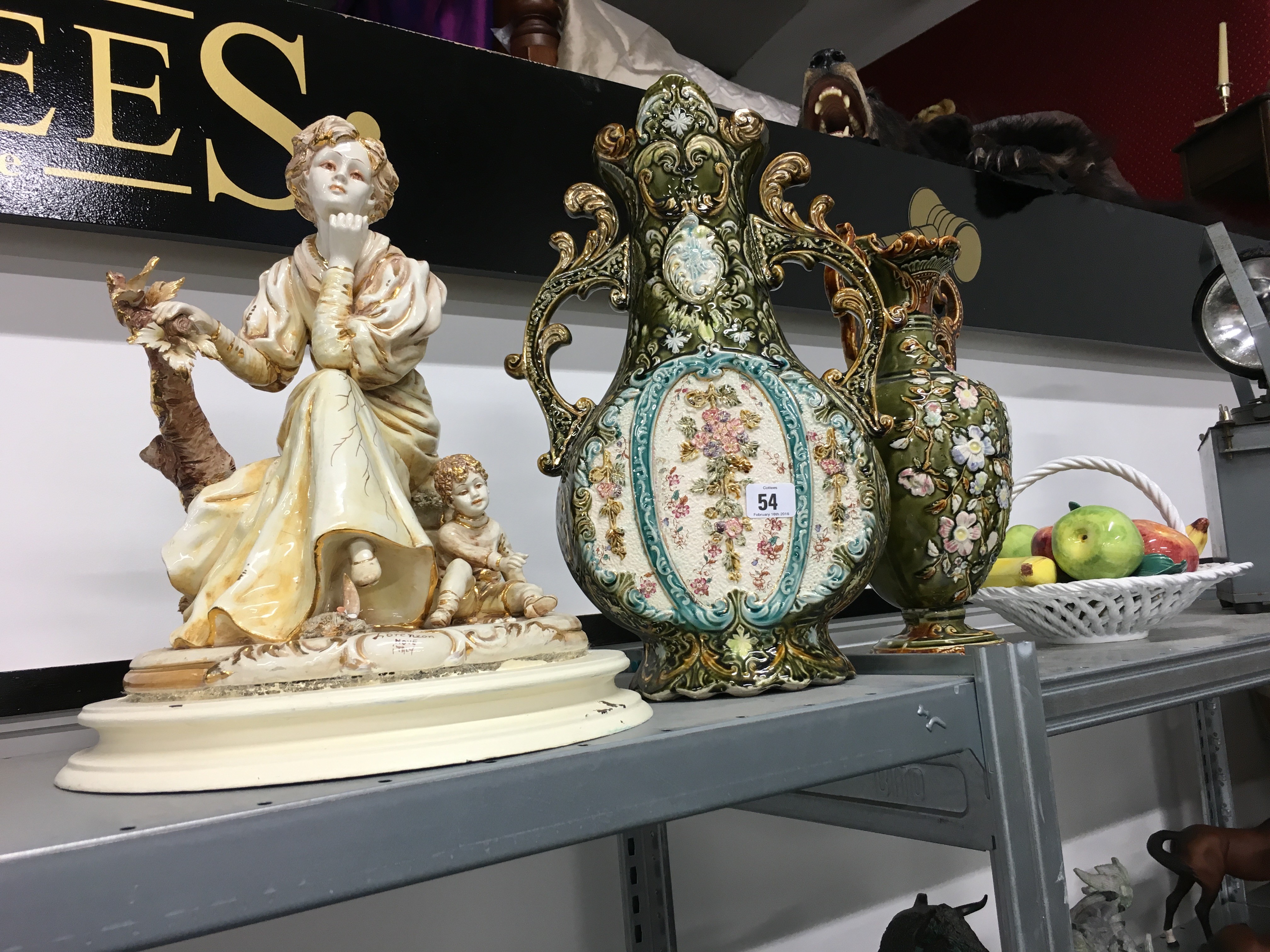 Two large Continental china twin handled vases together with a basket of china fruit and a china