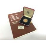 A gold Hong Kong 1987 $1000 coin: Year of the Rabbit in presentation case and original descriptive