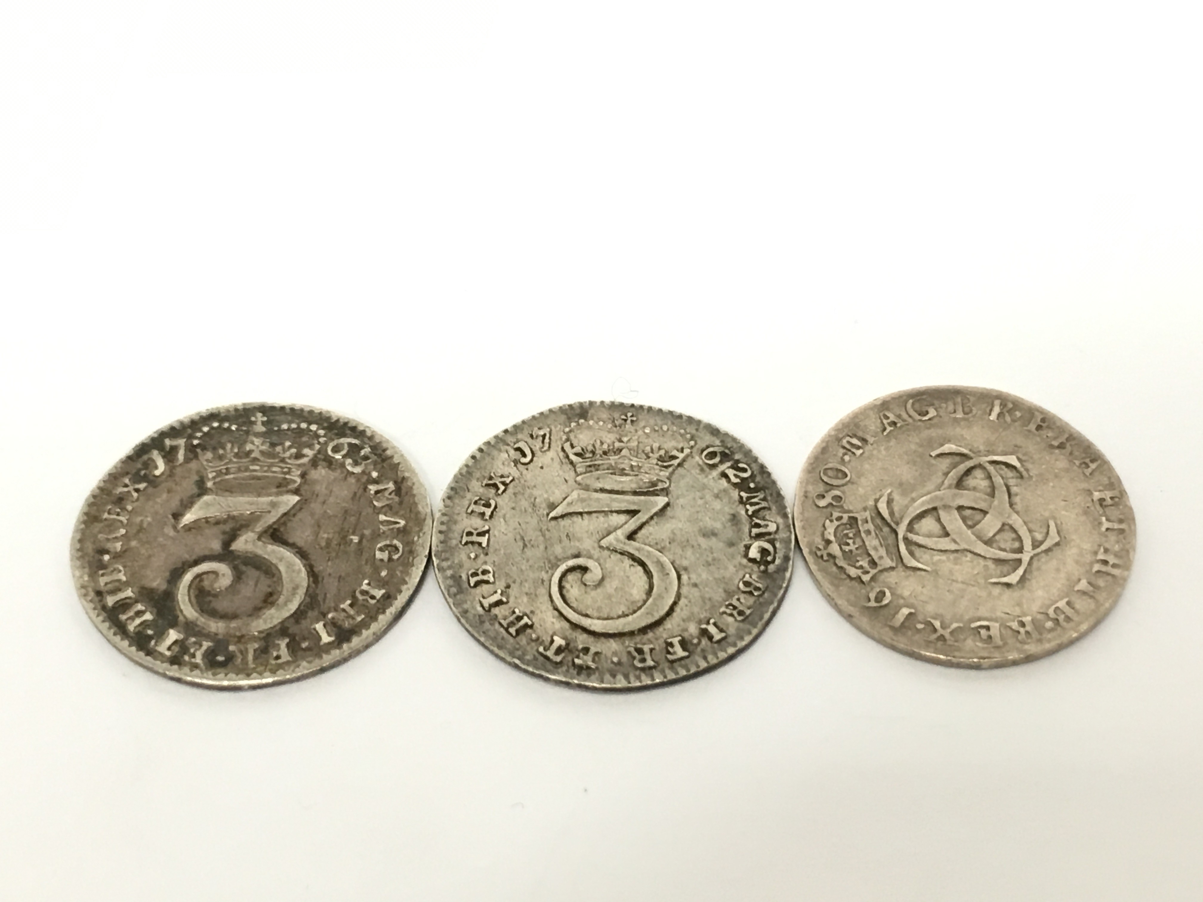 A 1763 silver 3d coin together with two other Georgian silver coins. - Image 2 of 2