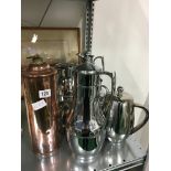 A collection of various stainless steel and chrome plated tea and coffee pots including Thermos