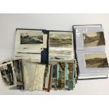 A box containing two postcard albums and contents together with various unsorted postcards.