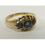 A gold sapphire and diamond ring.