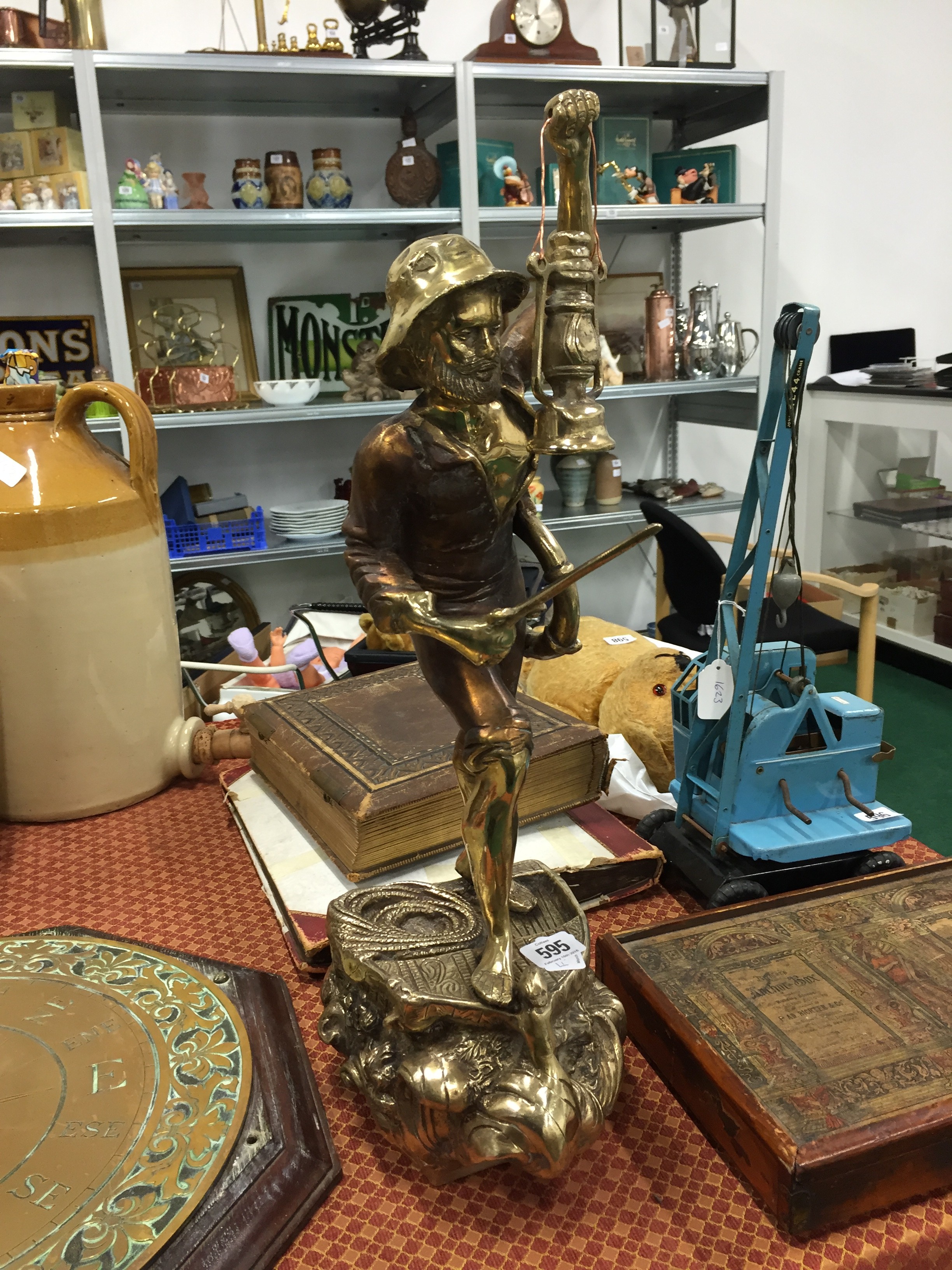 A polished brass figure modelled as a Lifeboat Man.