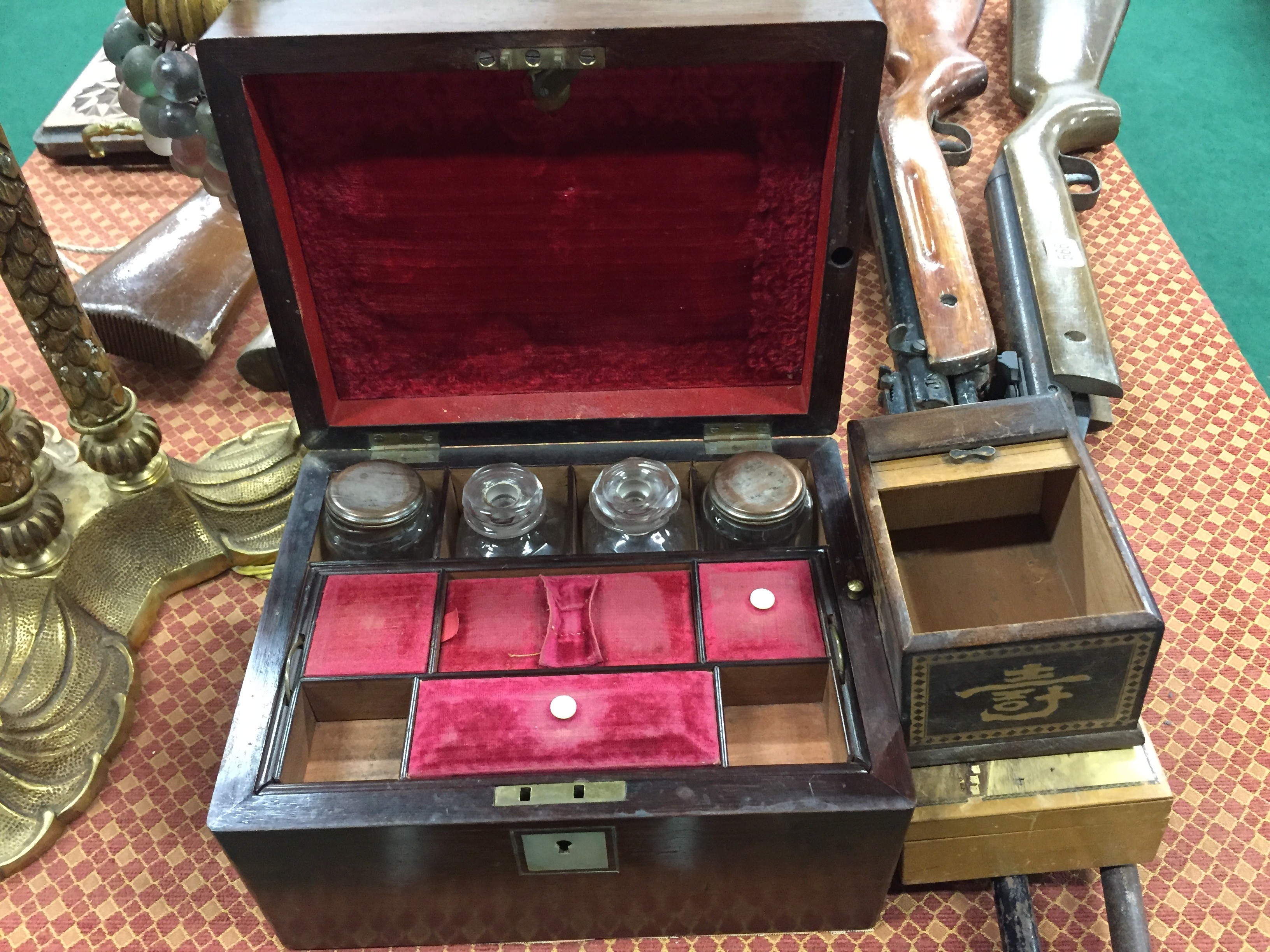A late 19th century rosewood vanity box with fitted interior together with two small boxes.
