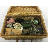 A basket containing a large quantity of costume jewellery.