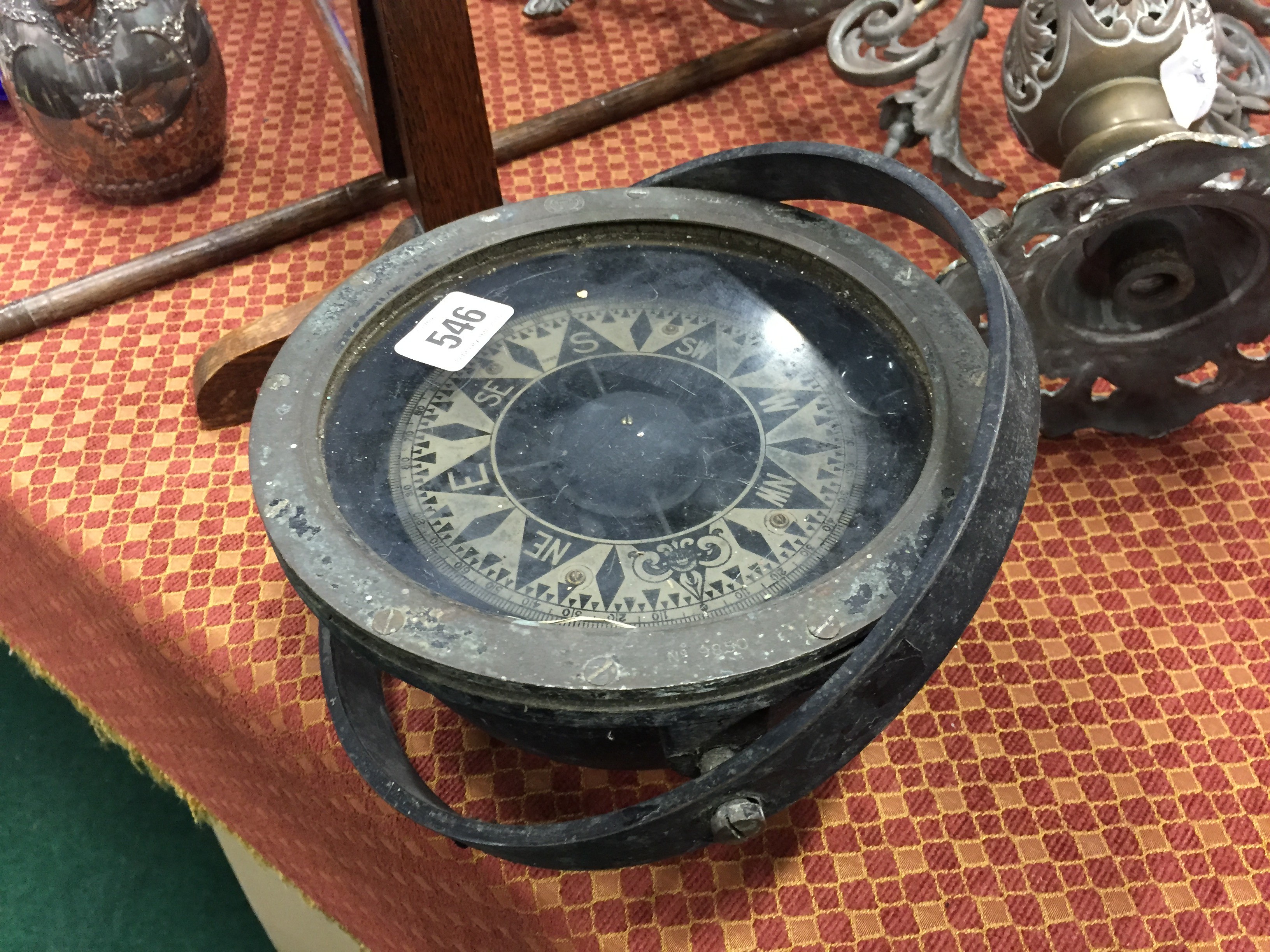 An early 20th century brass and metal cased ships compass.