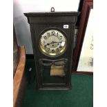 An early 20th century oak cased regulator wall clock.