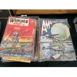 Two piles of mid 20th century American Science Fiction Amazing Stories and Wonder Stories magazines.