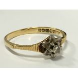 An 18 carat gold single diamond set ring.